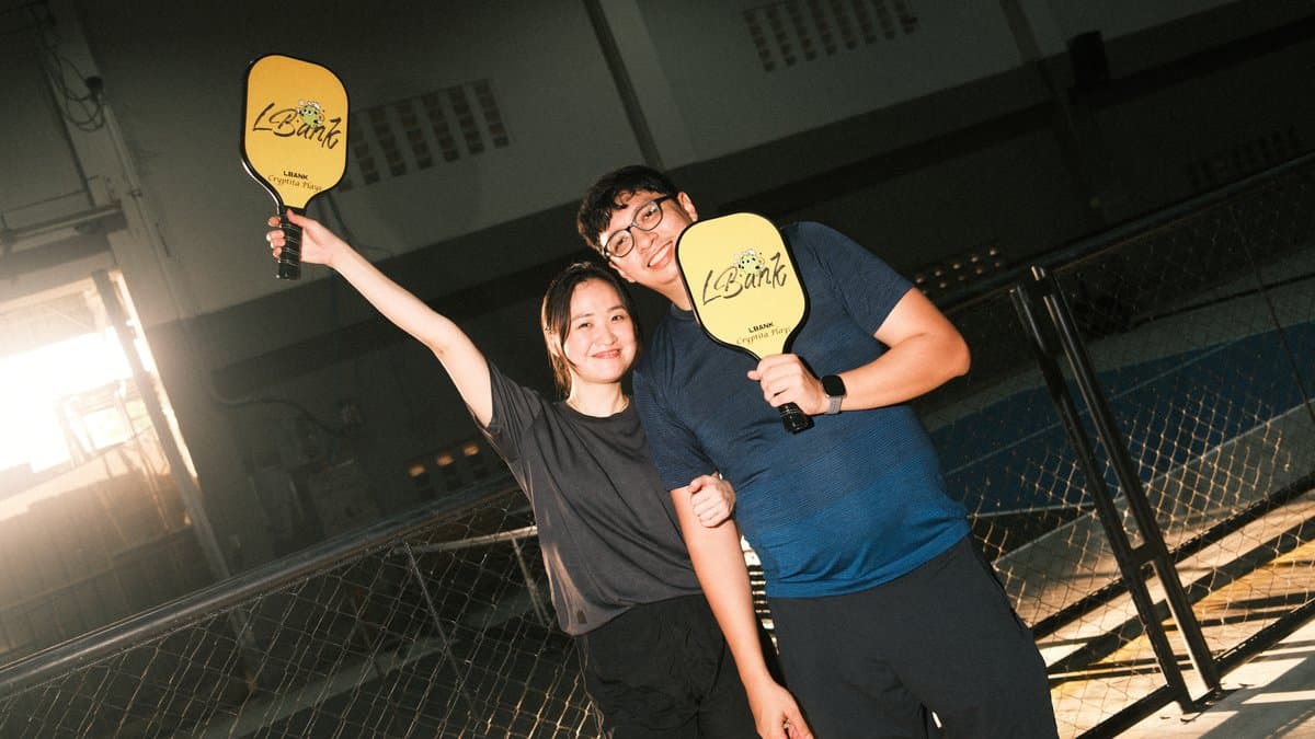 Monthly sporting event, members posing with paddles